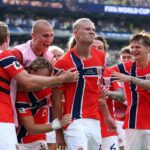 EAST RUTHERFORD, NEW JERSEY - JULY 05: Erling Haaland #9 of Norway celebrates with teammates after scoring his team's second goal during the FIFA World Cup 2026 Round of 16 match between Brazil and Norway at New York New Jersey Stadium on July 05, 2026 in East Rutherford, New Jersey.   Al Bello/Getty Images/AFP (Photo by AL BELLO / GETTY IMAGES NORTH AMERICA / Getty Images via AFP)